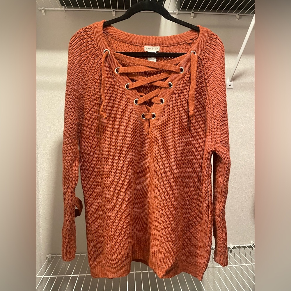 burnt orange lace-up sweater with lace up detailing